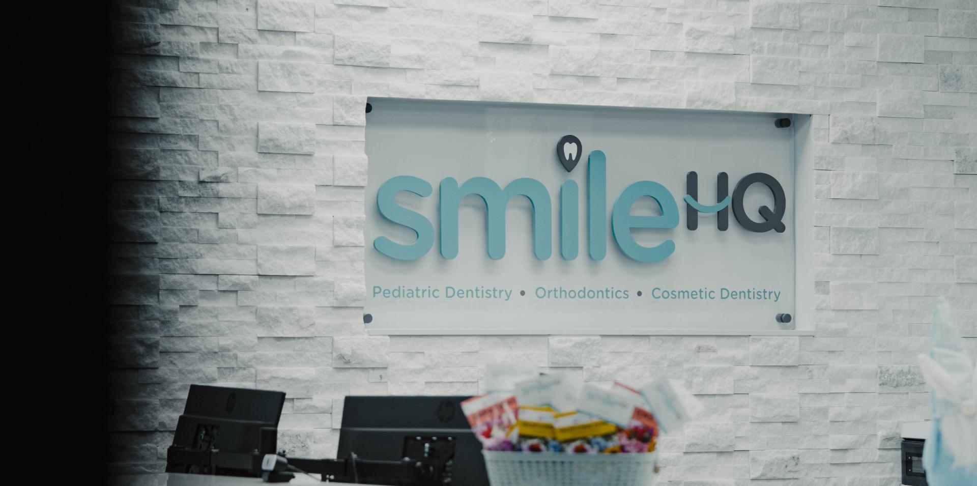 SmileHQ sign at the front desk area