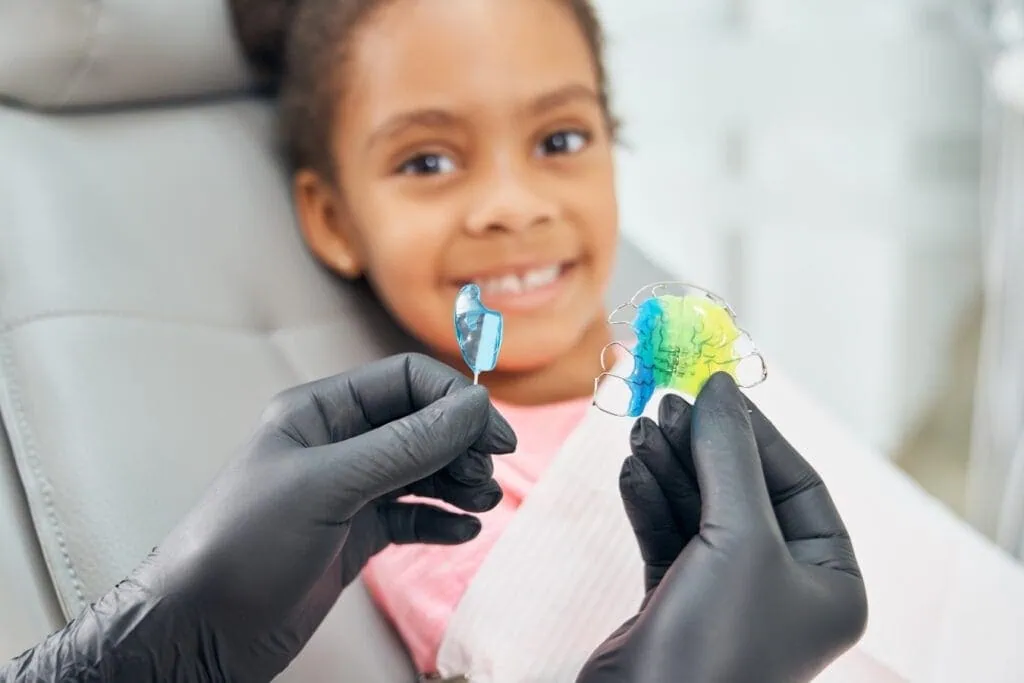 Young girl smiling with retainer