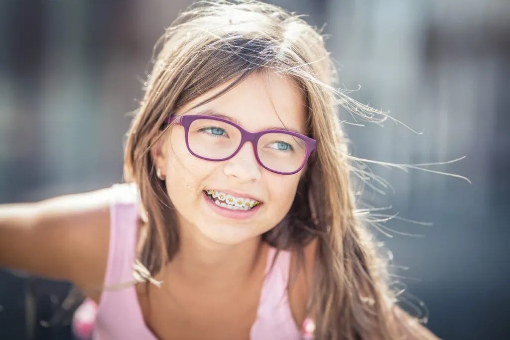 Young girl wearing braces and smiling
